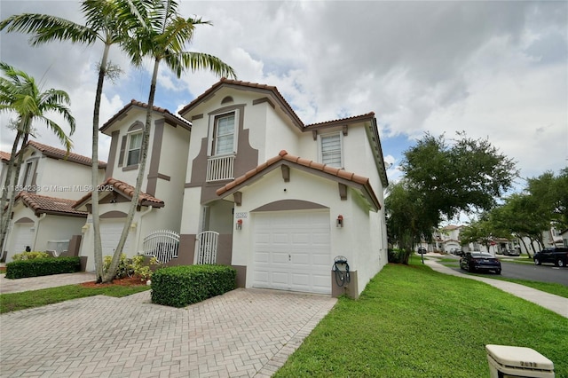 6293 SW 165th Ave, Miami, FL 33193 - mediterranean / spanish home featuring decorative driveway, a tiled roof, a garage, and stucco siding