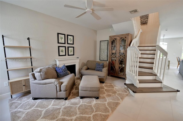 6293 SW 165th Ave, Miami, FL 33193 - sitting room featuring ceiling fan, stairway, a fireplace, and tile patterned flooring