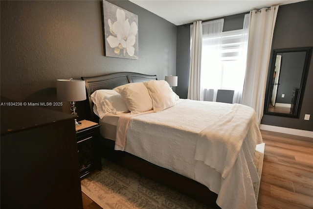 6293 SW 165th Ave, Miami, FL 33193 - bedroom featuring wood finished floors and a textured wall