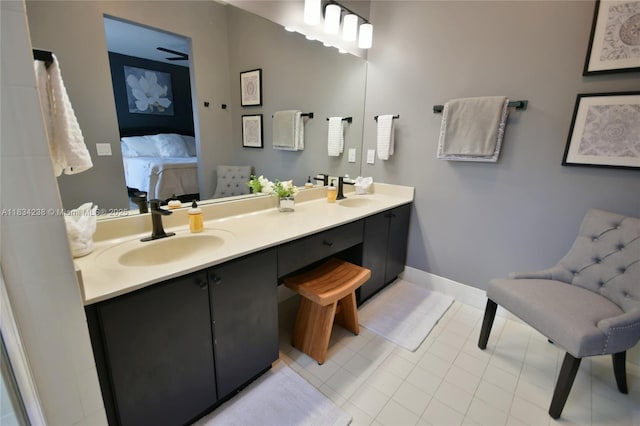 6293 SW 165th Ave, Miami, FL 33193 - bathroom with double vanity, connected bathroom, a ceiling fan, and tile patterned floors