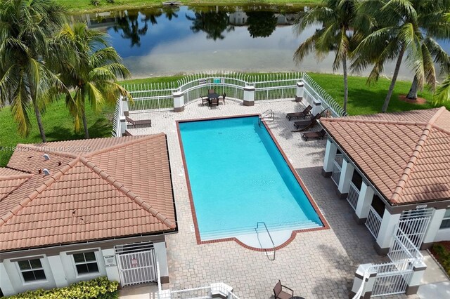 6293 SW 165th Ave, Miami, FL 33193 - community pool featuring a water view, a fenced backyard, and a patio area
