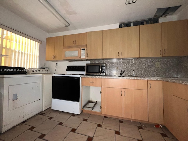 1555 W 44th Pl Unit 103, Hialeah, FL 33012 - kitchen with white appliances, tasteful backsplash, independent washer and dryer, and light brown cabinetry