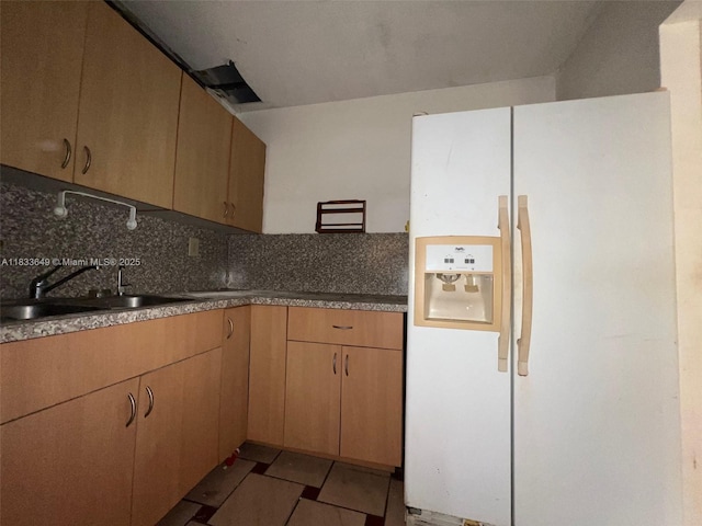 1555 W 44th Pl Unit 103, Hialeah, FL 33012 - kitchen with white fridge with ice dispenser and decorative backsplash
