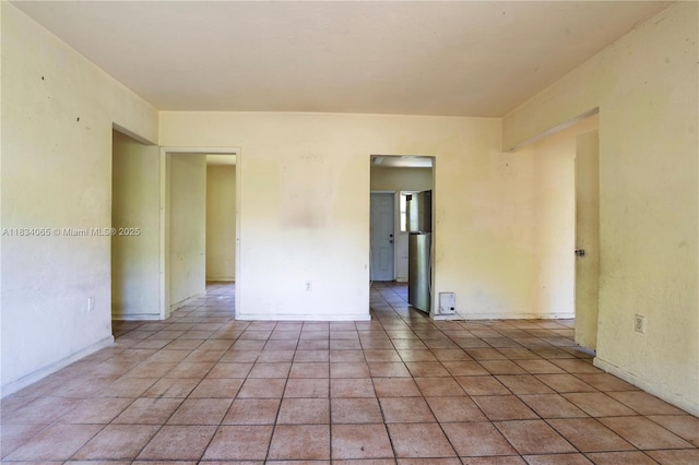 3255 William Ave, Miami, FL 33133 - empty room with light tile patterned flooring