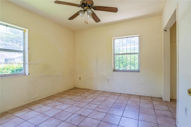 3255 William Ave, Miami, FL 33133 - empty room with healthy amount of natural light, a ceiling fan, and light tile patterned floors