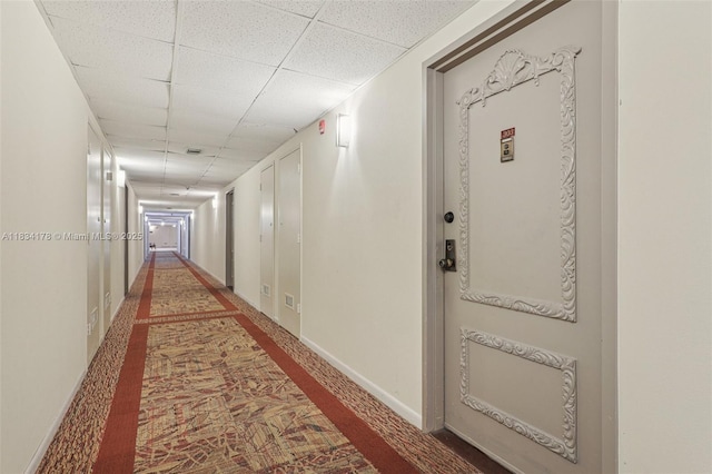 4350 Hillcrest Dr Unit 303, Hollywood, FL 33021 - hallway with a paneled ceiling and carpet flooring