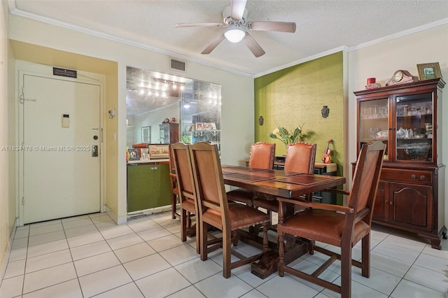 4350 Hillcrest Dr Unit 303, Hollywood, FL 33021 - dining room with ornamental molding, ceiling fan, a textured ceiling, and light tile patterned floors