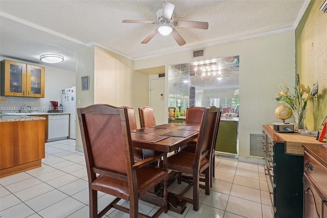 4350 Hillcrest Dr Unit 303, Hollywood, FL 33021 - dining area featuring a ceiling fan, a textured ceiling, crown molding, and light tile patterned flooring