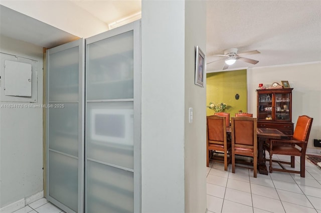 4350 Hillcrest Dr Unit 303, Hollywood, FL 33021 - dining room with light tile patterned flooring, a ceiling fan, and electric panel