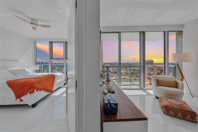 6899 Collins Ave Unit 2004, Miami Beach, FL 33141 - tiled living room with plenty of natural light and a wall of windows