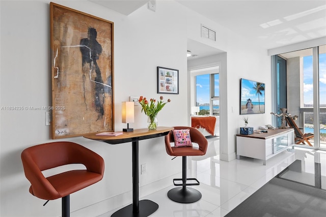 6899 Collins Ave Unit 2004, Miami Beach, FL 33141 - sitting room with healthy amount of natural light, tile patterned floors, and expansive windows
