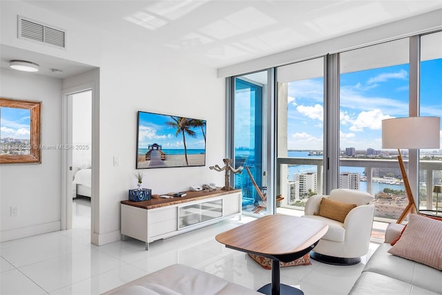 6899 Collins Ave Unit 2004, Miami Beach, FL 33141 - living room featuring plenty of natural light and light tile patterned floors