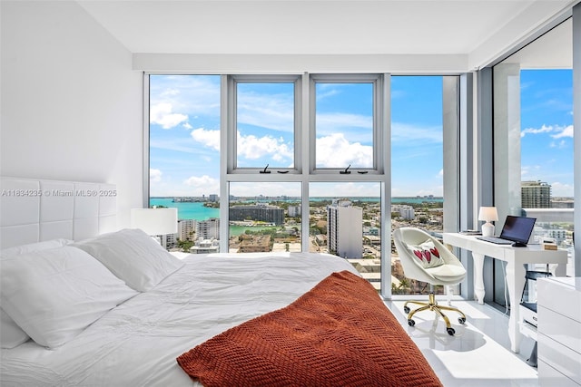6899 Collins Ave Unit 2004, Miami Beach, FL 33141 - bedroom with a water view, an office area, and floor to ceiling windows