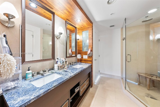 6899 Collins Ave Unit 2004, Miami Beach, FL 33141 - bathroom featuring a stall shower, double vanity, tile patterned flooring, and recessed lighting
