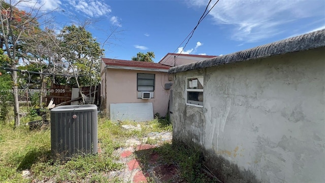 7080 Hope St, Hollywood, FL 33024 - view of property exterior featuring a central AC unit and stucco siding