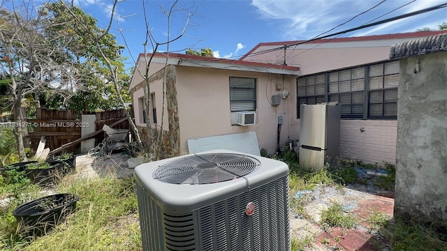 7080 Hope St, Hollywood, FL 33024 - view of side of home with stucco siding and cooling unit