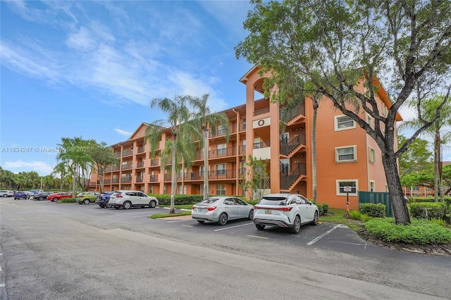 571 SW 142nd Ave Unit 410O, Pembroke Pines, FL 33027 - view of apartment building / complex featuring uncovered parking