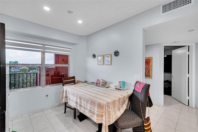 571 SW 142nd Ave Unit 410O, Pembroke Pines, FL 33027 - dining space featuring light tile patterned floors, recessed lighting, and a textured ceiling