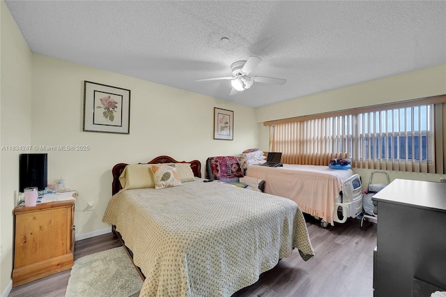 571 SW 142nd Ave Unit 410O, Pembroke Pines, FL 33027 - bedroom with wood finished floors, ceiling fan, and a textured ceiling