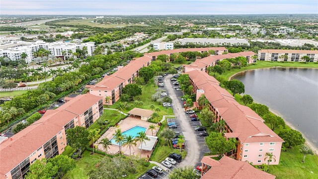 571 SW 142nd Ave Unit 410O, Pembroke Pines, FL 33027 - drone / aerial view of a pool and a large body of water