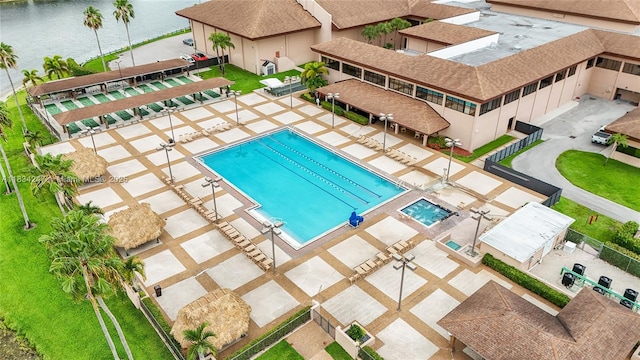 571 SW 142nd Ave Unit 410O, Pembroke Pines, FL 33027 - community pool featuring a water view and a patio