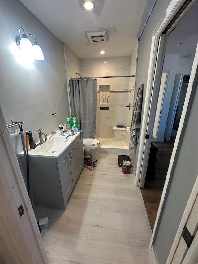 5900 NE 21st Ln, Fort Lauderdale, FL 33308 - full bathroom featuring a shower stall, wood finished floors, and vanity