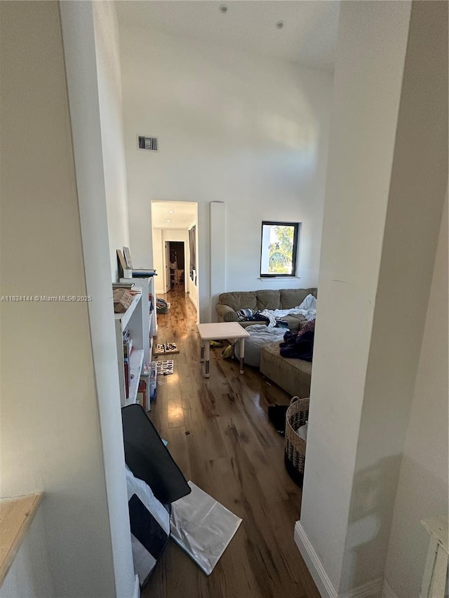 5900 NE 21st Ln, Fort Lauderdale, FL 33308 - living room with wood finished floors and a towering ceiling
