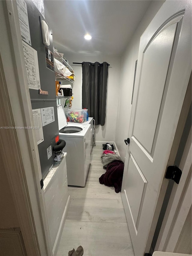 5900 NE 21st Ln, Fort Lauderdale, FL 33308 - laundry room featuring washing machine and clothes dryer, light wood-style floors, and recessed lighting