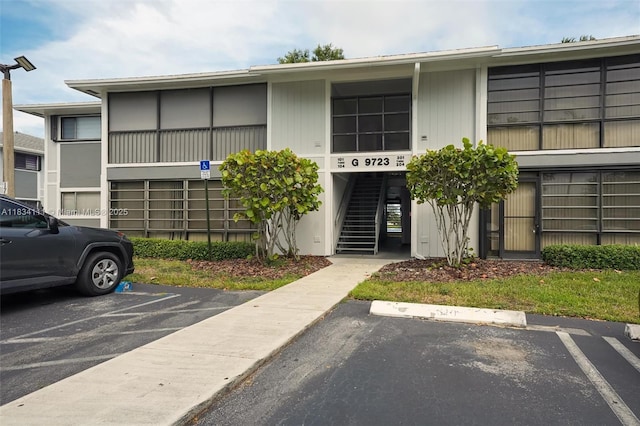 9723 Hammocks Blvd Unit 102, Miami, FL 33196 - view of building exterior with uncovered parking and stairs