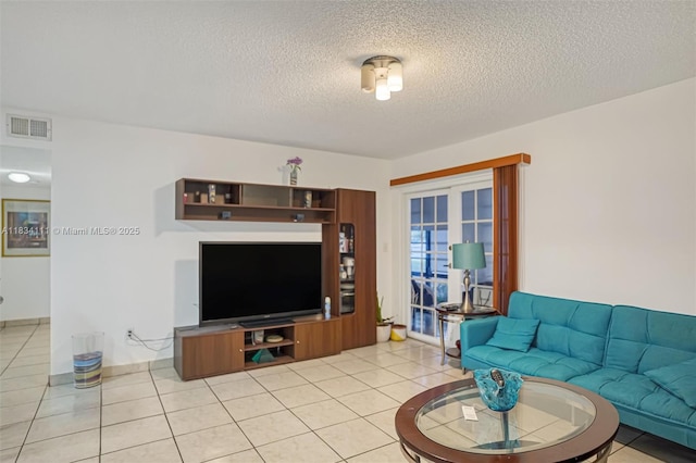 9723 Hammocks Blvd Unit 102, Miami, FL 33196 - living area with a textured ceiling and light tile patterned floors