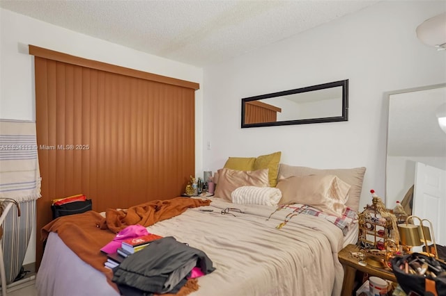 9723 Hammocks Blvd Unit 102, Miami, FL 33196 - bedroom featuring a textured ceiling