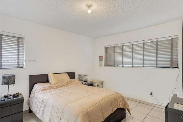 9723 Hammocks Blvd Unit 102, Miami, FL 33196 - bedroom with light tile patterned floors and a textured ceiling