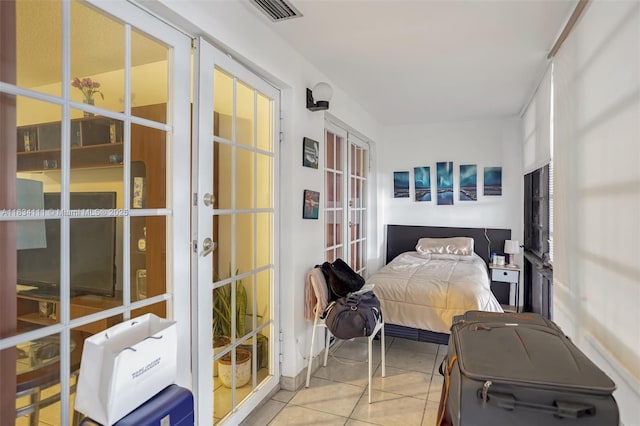 9723 Hammocks Blvd Unit 102, Miami, FL 33196 - bedroom featuring french doors and tile patterned flooring