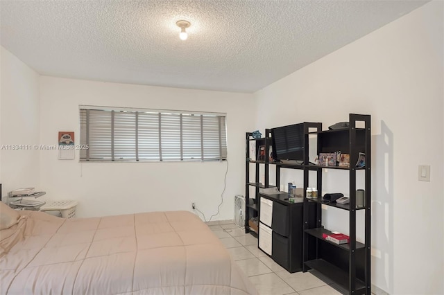 9723 Hammocks Blvd Unit 102, Miami, FL 33196 - bedroom with a textured ceiling and light tile patterned floors
