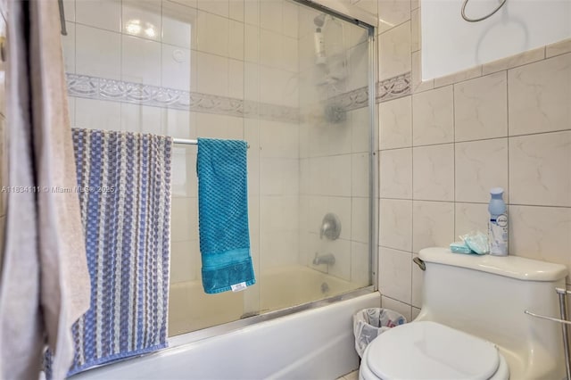 9723 Hammocks Blvd Unit 102, Miami, FL 33196 - bathroom featuring tile walls and combined bath / shower with glass door