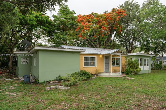 7997 SW 98th Ter, Miami, FL 33156 - ranch-style home featuring a front yard and a metal roof