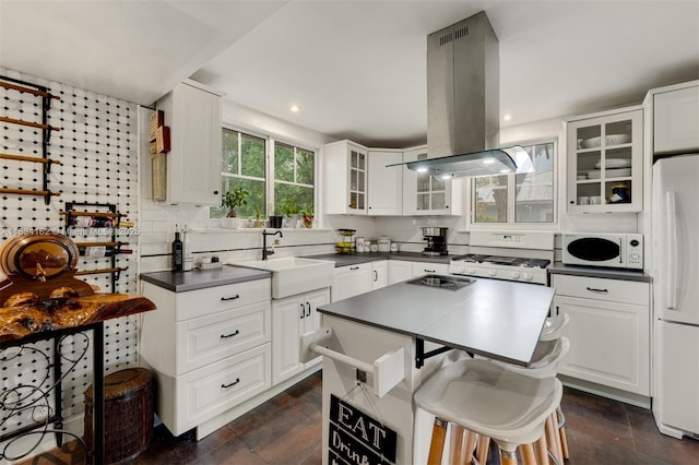 7997 SW 98th Ter, Miami, FL 33156 - kitchen with white appliances, island exhaust hood, dark countertops, glass insert cabinets, and recessed lighting