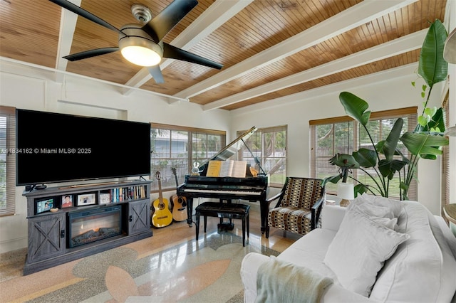 7997 SW 98th Ter, Miami, FL 33156 - living room with a wood ceiling with exposed beams, a glass covered fireplace, speckled floor, and ceiling fan