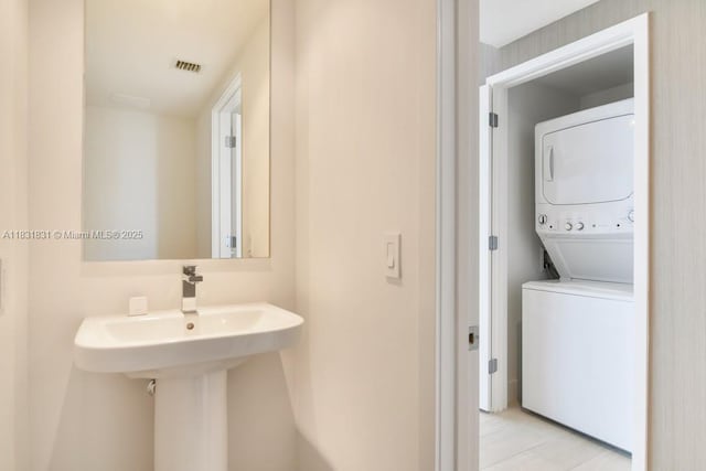 4010 S Ocean Dr Unit R1406, Hollywood, FL 33019 - bathroom featuring stacked washer and clothes dryer