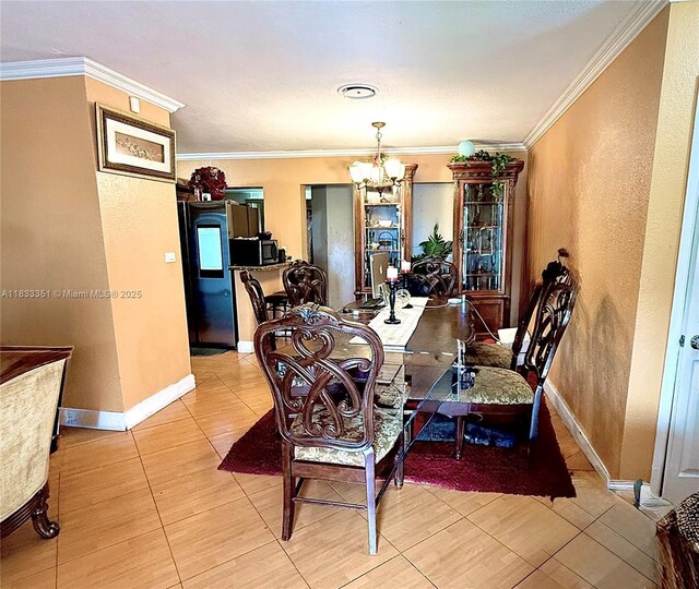 701 NW 176th Ter, Miami Gardens, FL 33169 - dining room featuring a chandelier, crown molding, and tile patterned flooring