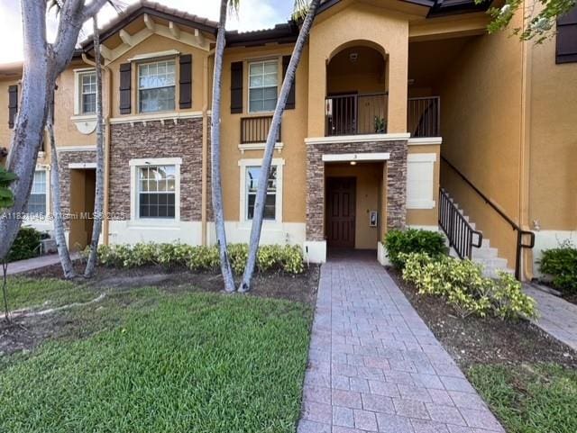 9267 SW 227th St Unit 5-8, Cutler Bay, FL 33190 - townhome / multi-family property featuring stucco siding, stone siding, and a balcony