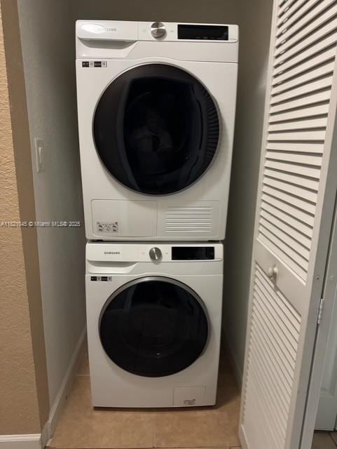 9267 SW 227th St Unit 5-8, Cutler Bay, FL 33190 - laundry area with stacked washer / dryer and light tile patterned floors