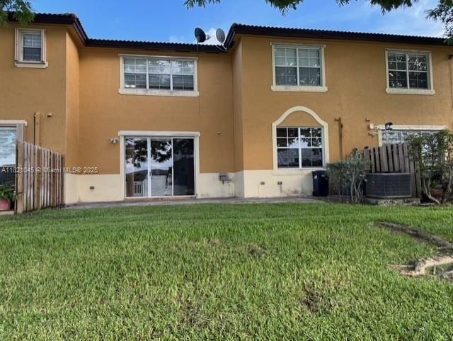 9267 SW 227th St Unit 5-8, Cutler Bay, FL 33190 - rear view of house with stucco siding and a yard
