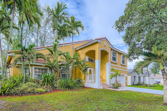 12700 SW 18th St, Miramar, FL 33027 - mediterranean / spanish-style house with an attached garage, stucco siding, concrete driveway, and a front yard