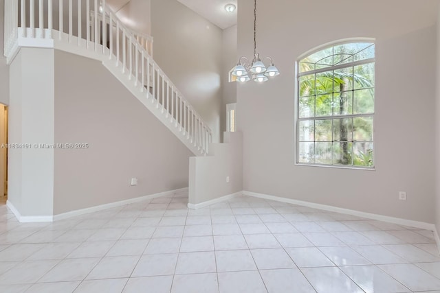 12700 SW 18th St, Miramar, FL 33027 - entryway featuring a high ceiling, a chandelier, stairway, and light tile patterned floors