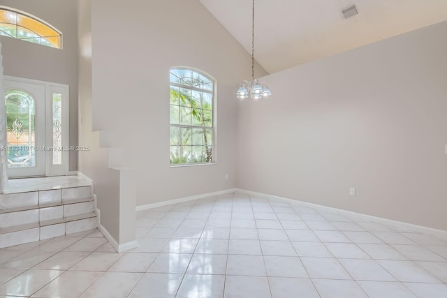 12700 SW 18th St, Miramar, FL 33027 - foyer entrance featuring high vaulted ceiling, a chandelier, light tile patterned floors, and stairway