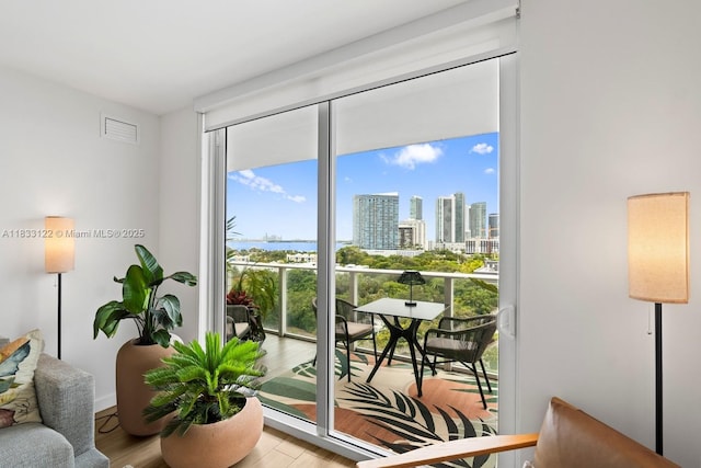 4250 Biscayne Blvd Unit 1218, Miami, FL 33137 - doorway with a skyline view, wood finished floors, and expansive windows