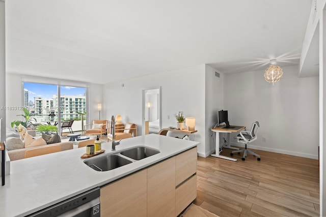4250 Biscayne Blvd Unit 1218, Miami, FL 33137 - kitchen with dishwasher, light wood-style floors, a desk, light countertops, and open floor plan