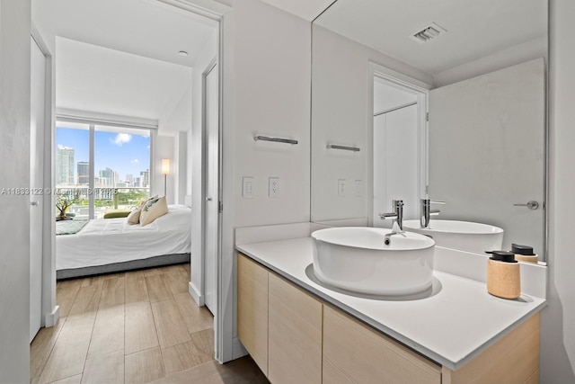 4250 Biscayne Blvd Unit 1218, Miami, FL 33137 - bathroom featuring ensuite bath, vanity, and a view of skyline