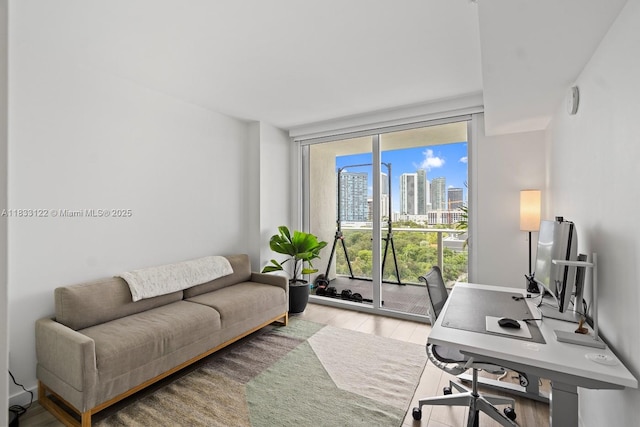 4250 Biscayne Blvd Unit 1218, Miami, FL 33137 - home office featuring a wall of windows and light wood-style floors